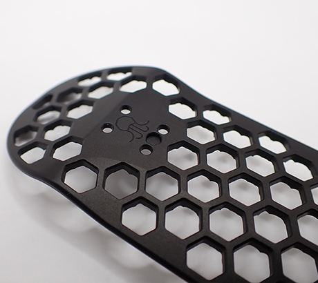 Metal fingerboard with machined grip in black.